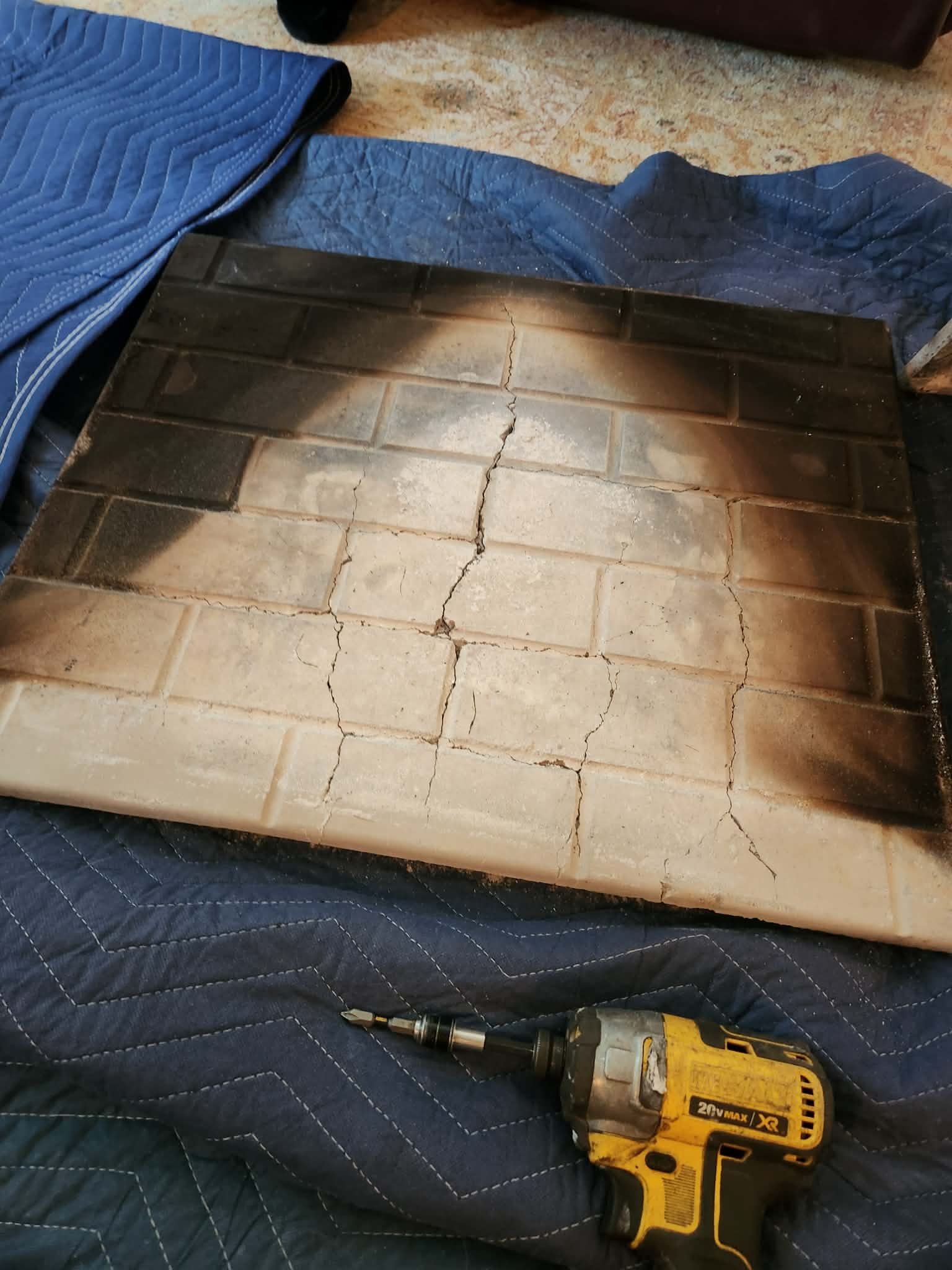 Heat cracking damage on a fireplace refractory panel